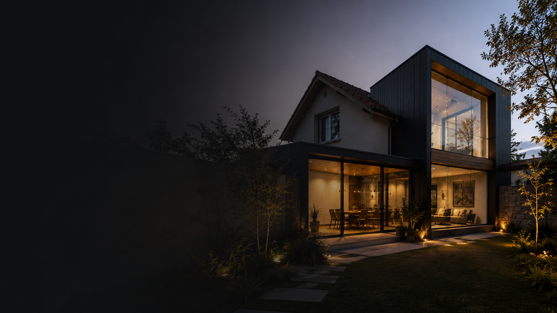 Casa contemporánea a medida con luz cálida, vidrio, madera y hormigón.